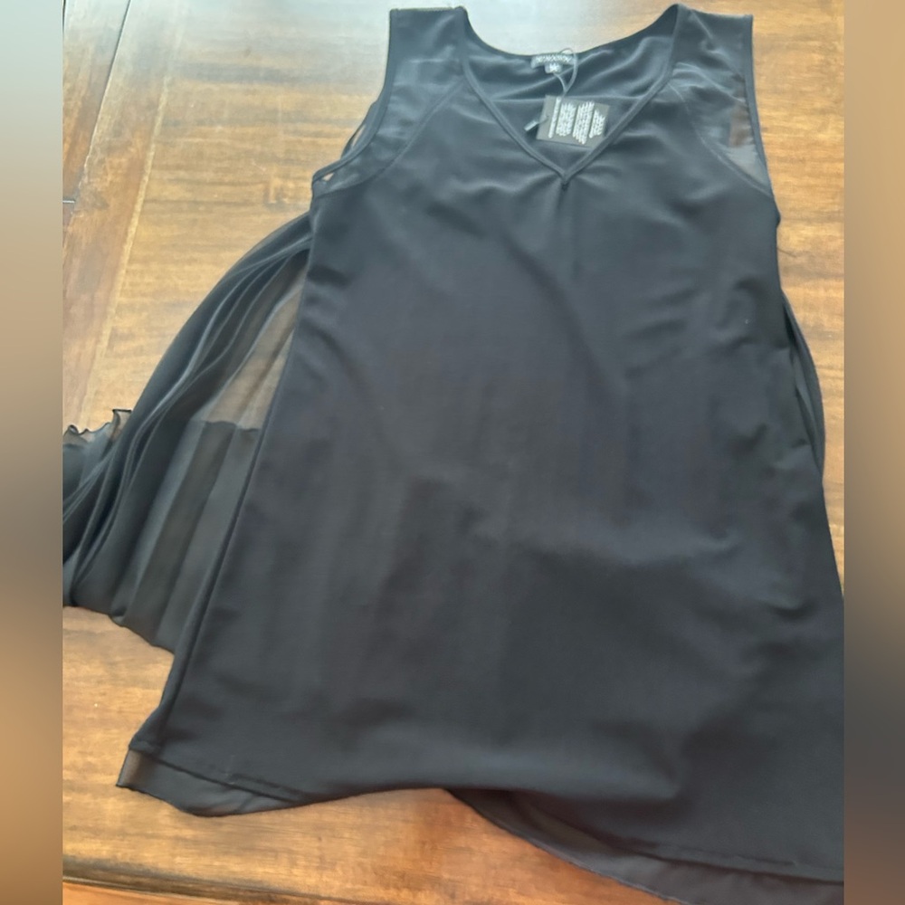 Komarov black top with pleated cape in the back. Size M. Stretchy fabric.